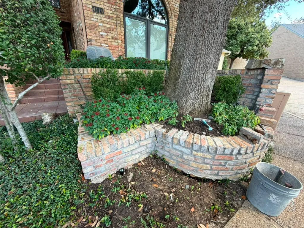 Brick retaining wall before rebuild — collapsed section — Dallas Fort Worth TX