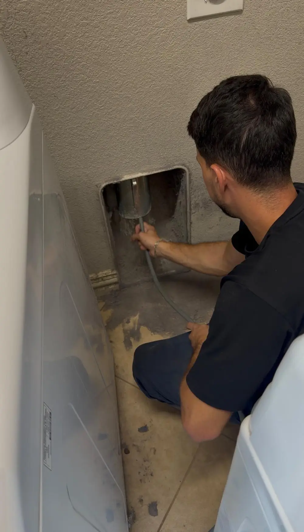 Dryer vent cleaning technician at work in Dallas–Fort Worth