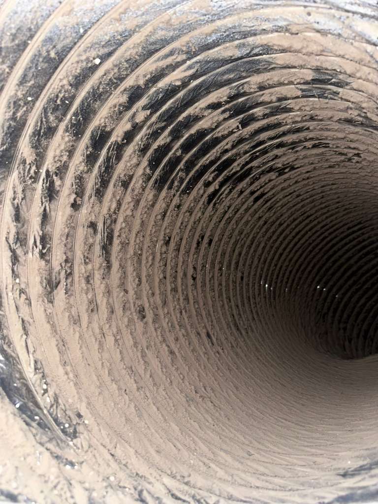 Chimney flue before sweeping — heavy creosote and soot buildup — Dallas TX