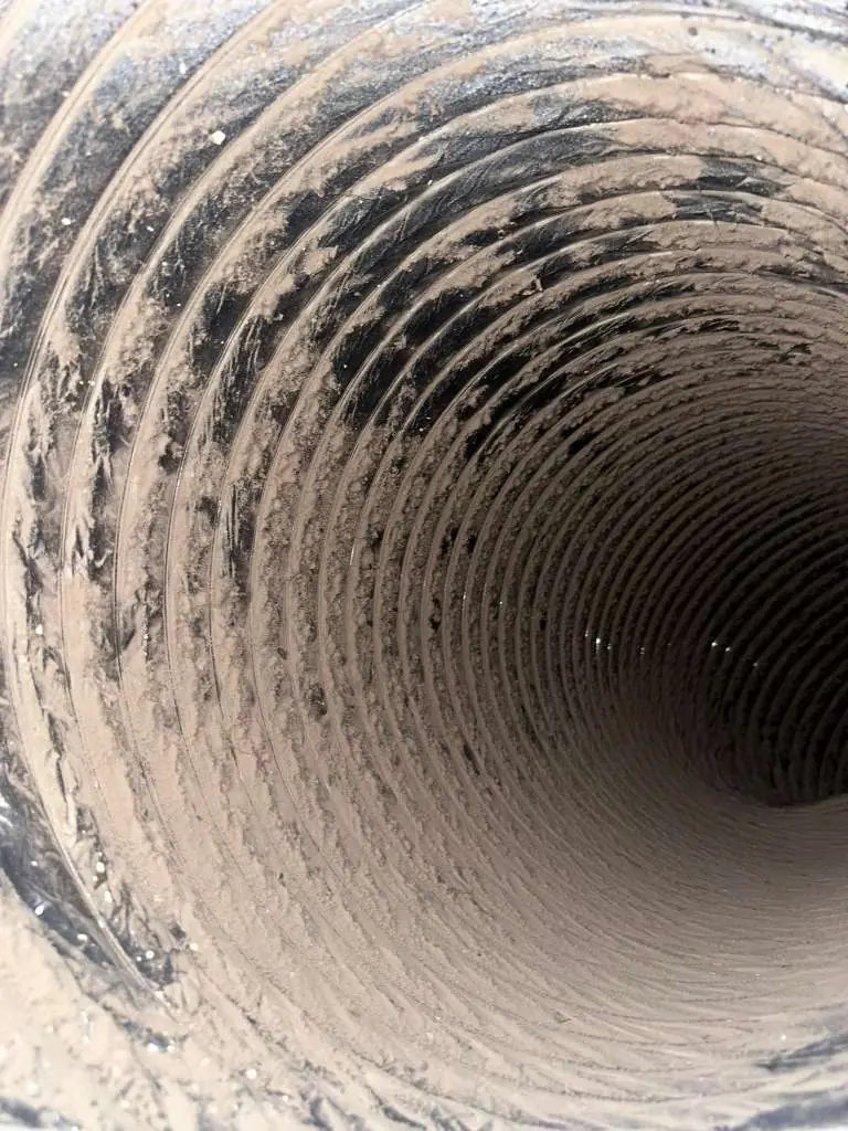 Air duct before cleaning — dust and debris buildup — Dallas Fort Worth TX