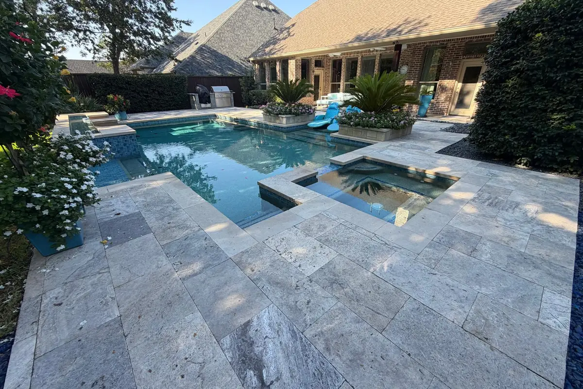 Pool deck after travertine paver installation — Dallas Fort Worth TX