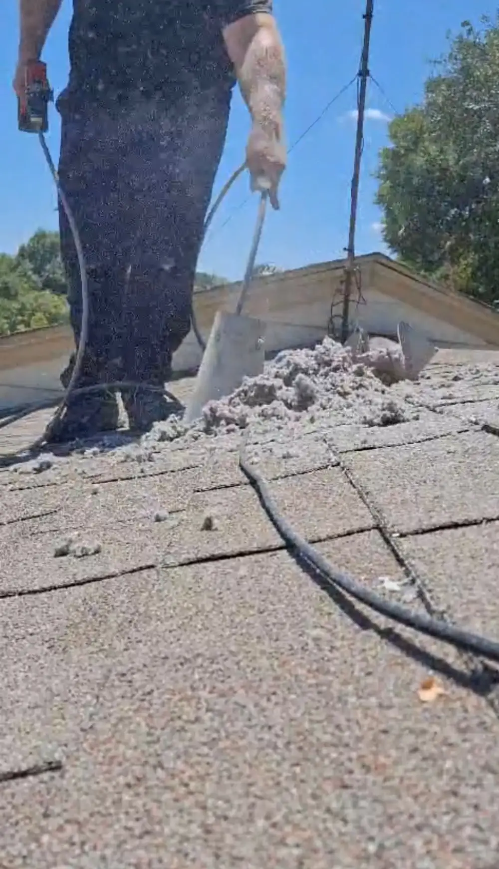Technician cleaning dryer vent from the rooftop Dallas Fort Worth TX