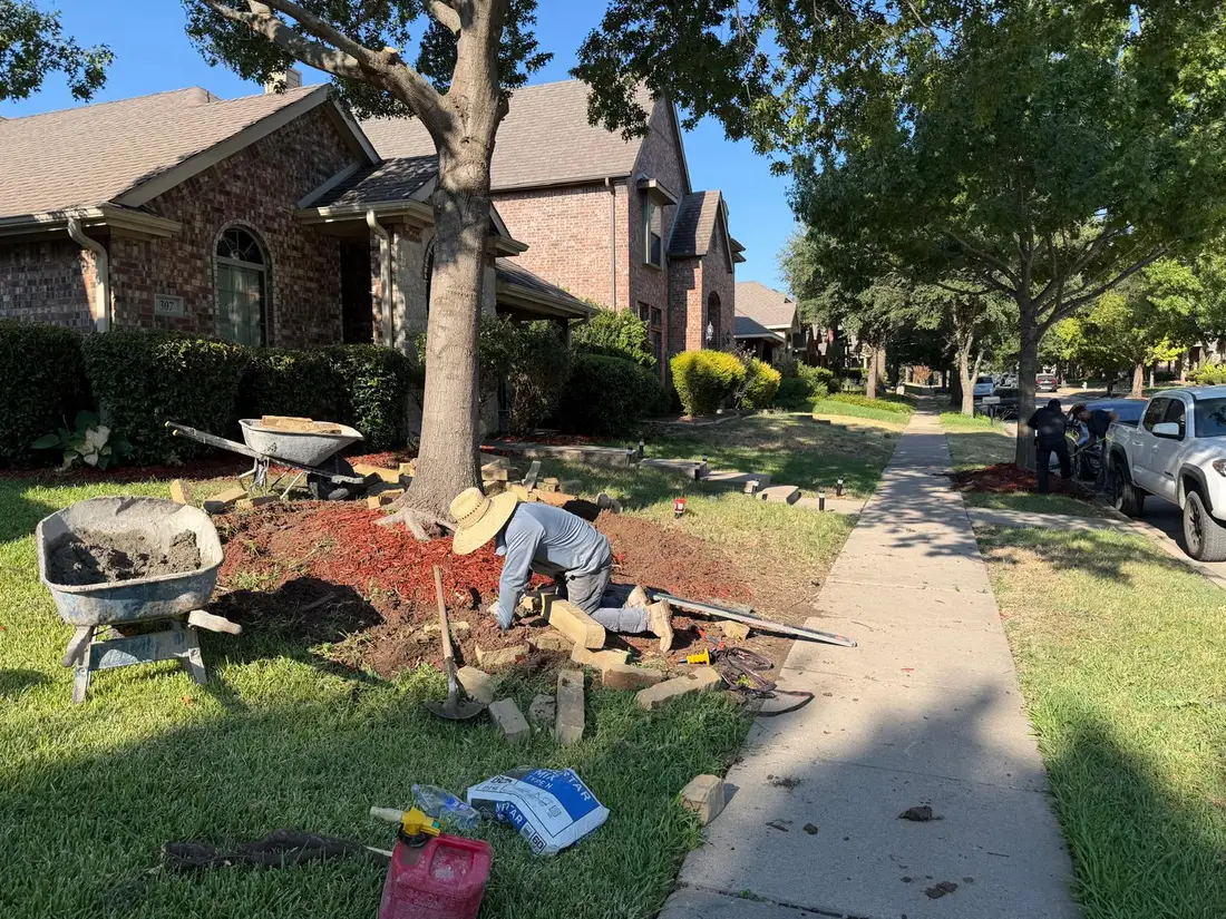 Stone border flower bed installation in progress Dallas Fort Worth TX